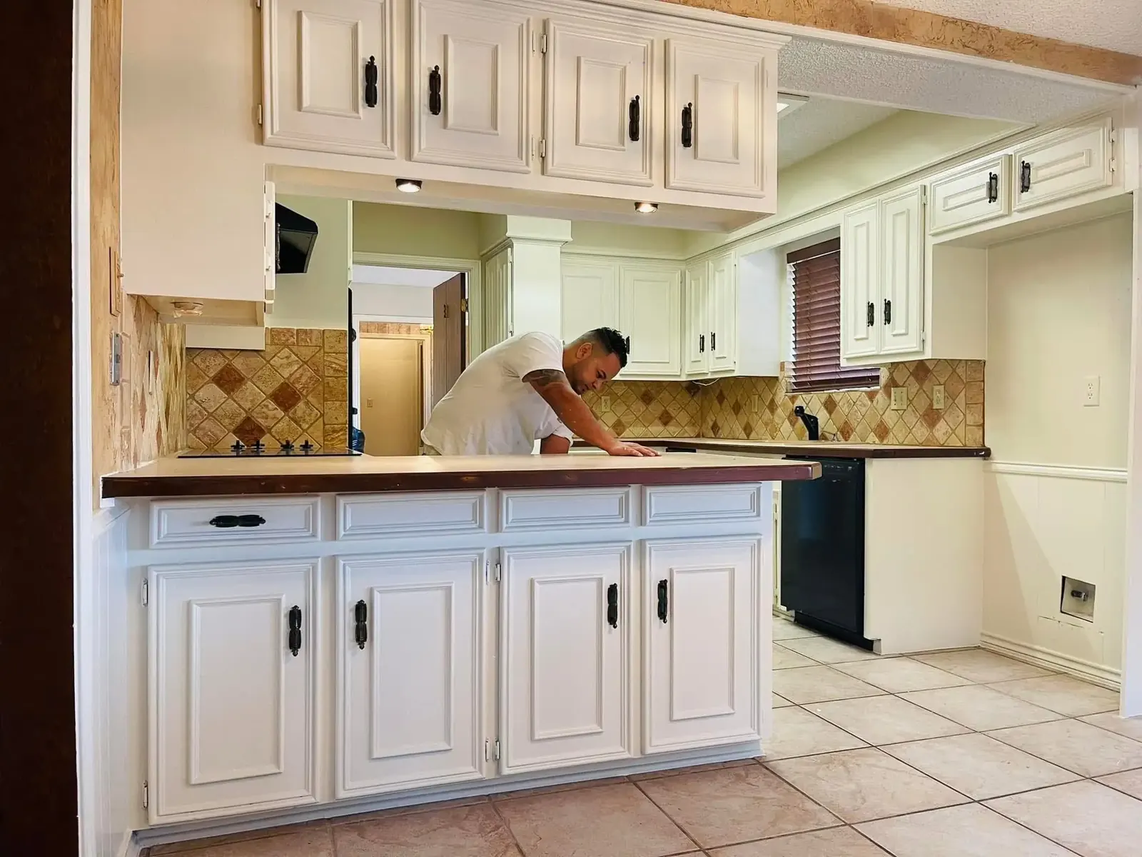 Kitchen after cabinet and wall repaint by JCL Painting LLC
